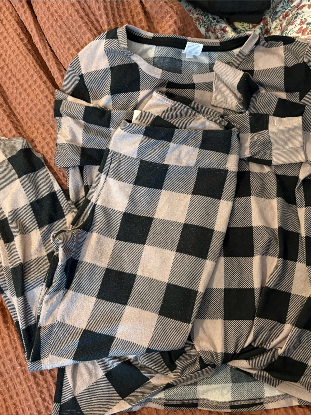 stars above black and pink plaid pajama set